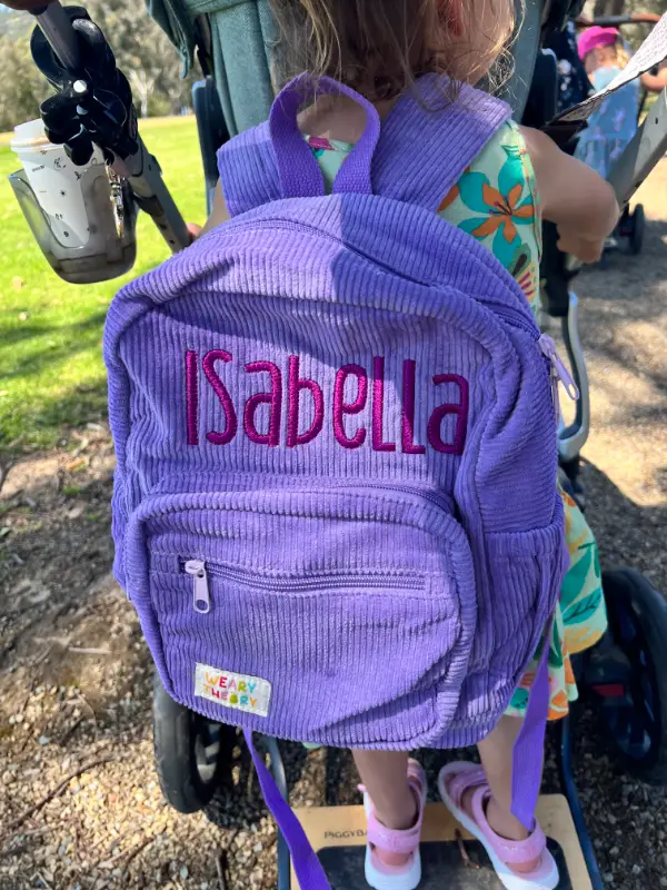 Social image of a happy Weary Theory customer with their new backpack.